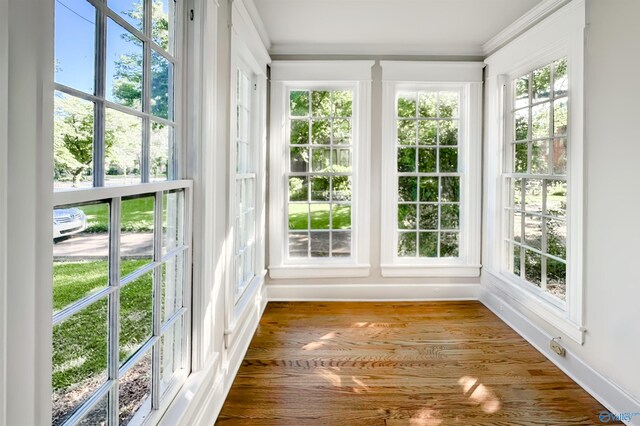 605 Ferry St, Decatur, AL 35601 - unfurnished sunroom featuring crown molding, french doors, and wood finished floors
