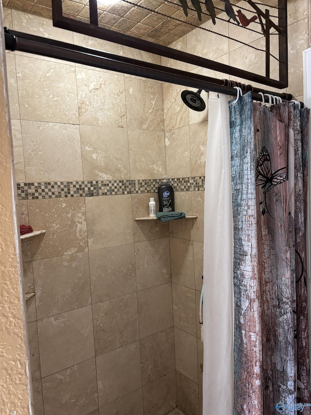 full bath featuring tiled shower