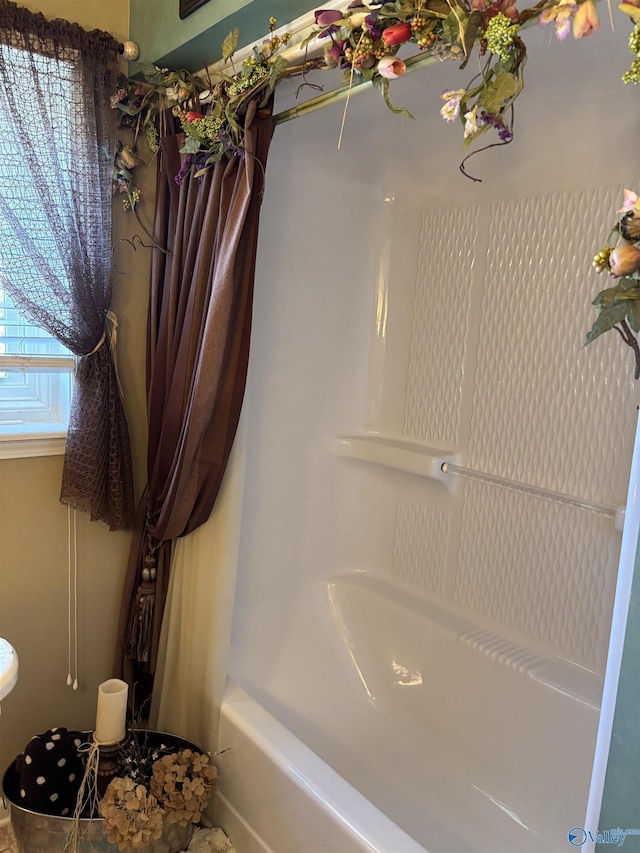 full bath featuring  shower combination