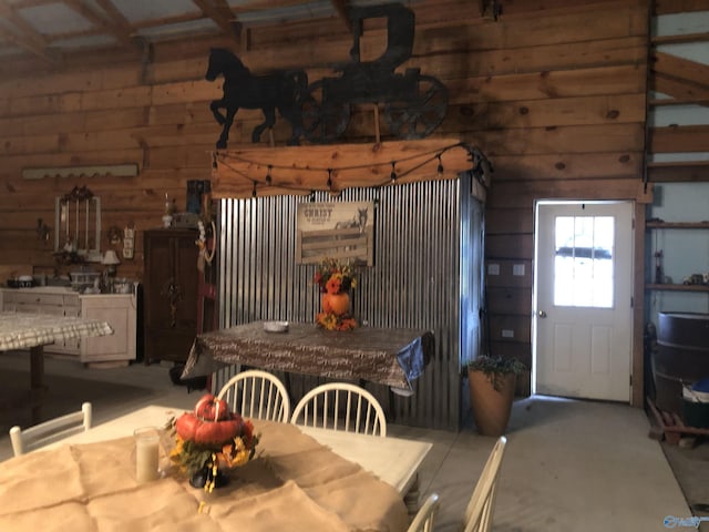 dining space with wooden walls