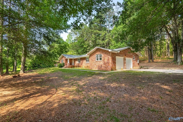 2810 Mountain View Dr, Southside, AL 35907 - view of front of property with concrete driveway, brick siding, and a garage