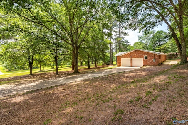 2810 Mountain View Dr, Southside, AL 35907 - view of yard with a garage and concrete driveway