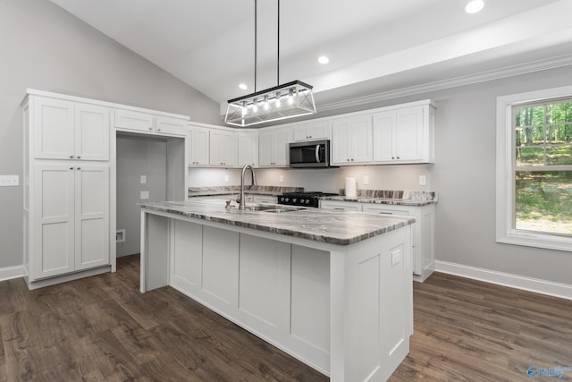 2810 Mountain View Dr, Southside, AL 35907 - kitchen featuring stainless steel microwave, black range with gas cooktop, white cabinetry, light stone countertops, and a center island with sink