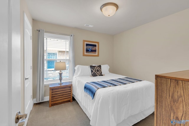 2626 SW Ashtynn Pl, Huntsville, AL 35803 - carpeted bedroom featuring baseboards