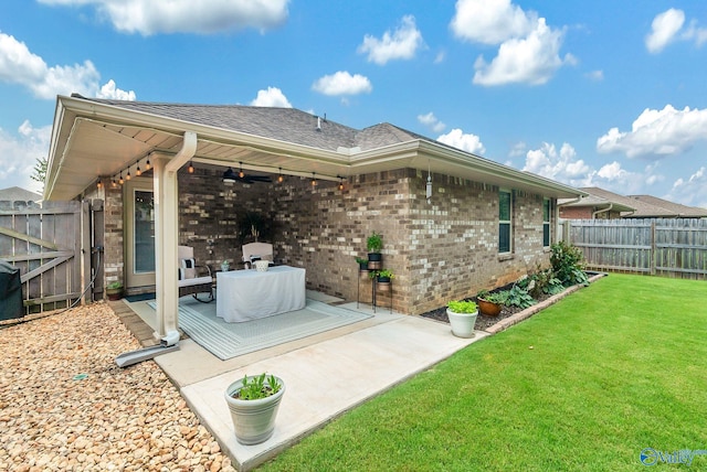 2626 SW Ashtynn Pl, Huntsville, AL 35803 - rear view of house featuring a ceiling fan, a patio area, a fenced backyard, brick siding, and a shingled roof