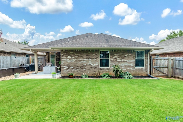2626 SW Ashtynn Pl, Huntsville, AL 35803 - back of house with a patio area, a fenced backyard, roof with shingles, and brick siding