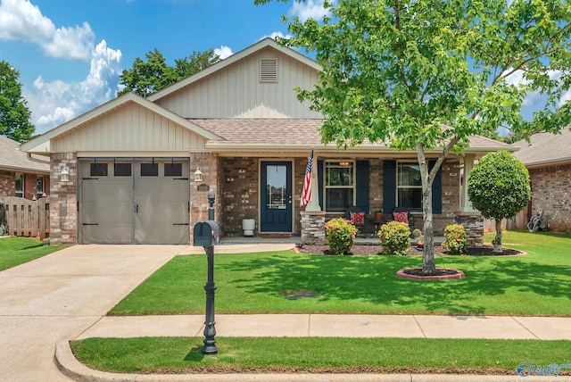 2626 SW Ashtynn Pl, Huntsville, AL 35803 - view of front facade with covered porch, a garage, a front yard, concrete driveway, and roof with shingles