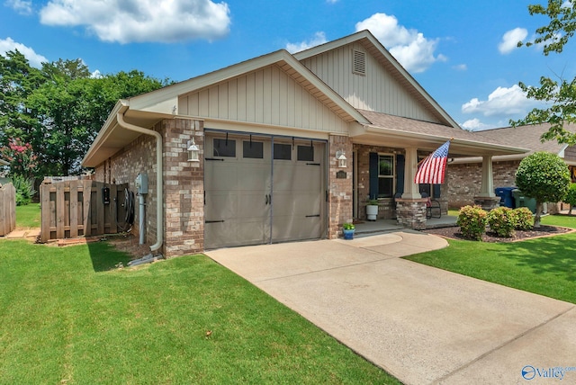 2626 SW Ashtynn Pl, Huntsville, AL 35803 - craftsman inspired home with an attached garage, concrete driveway, brick siding, and covered porch