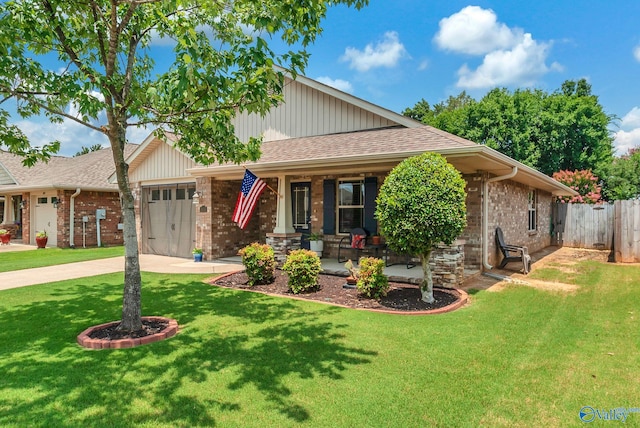 2626 SW Ashtynn Pl, Huntsville, AL 35803 - view of front of house featuring covered porch, a garage, brick siding, roof with shingles, and concrete driveway