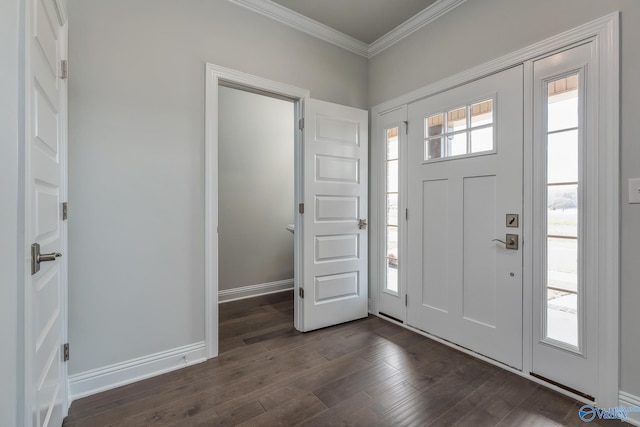 entrance foyer with dark hardwood / wood-style floors and ornamental molding