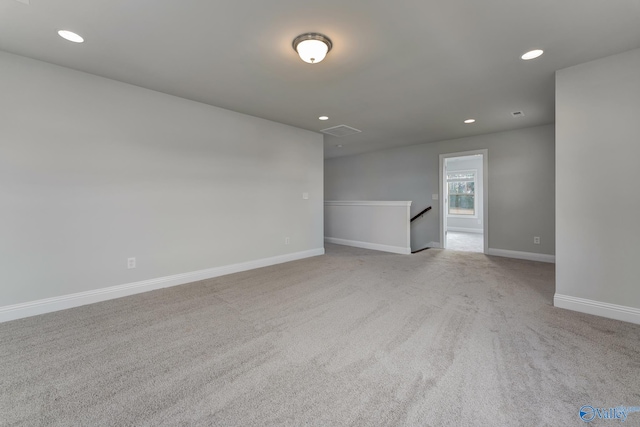 empty room with light colored carpet