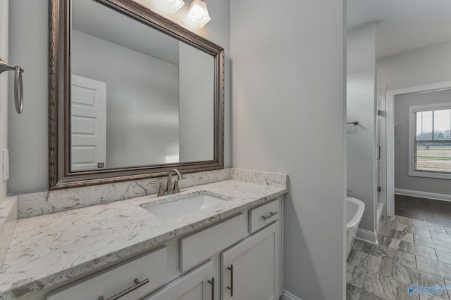 bathroom featuring a bath and vanity