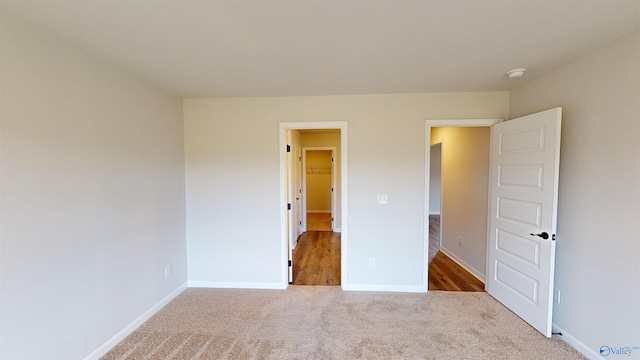 unfurnished bedroom with carpet flooring