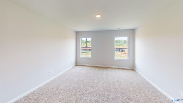 unfurnished room featuring carpet flooring