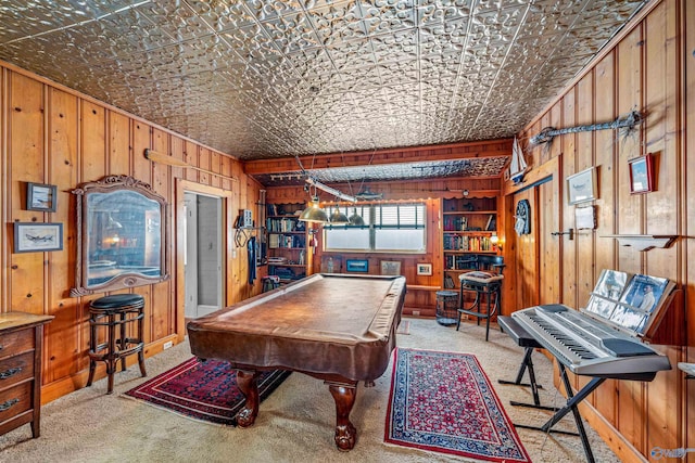 rec room with wooden walls, pool table, carpet floors, and an ornate ceiling