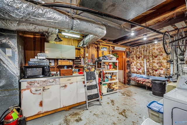 unfinished below grade area with washer / dryer