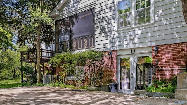 exterior space featuring brick siding