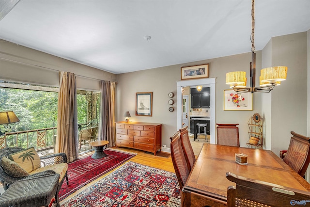 interior space with light wood-style flooring and a notable chandelier
