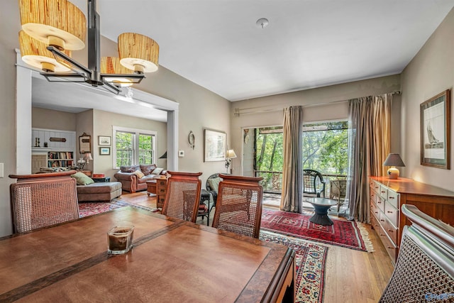 dining area with wood finished floors