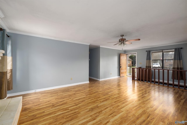 unfurnished living room featuring light wood-type flooring, crown molding, and ceiling fan