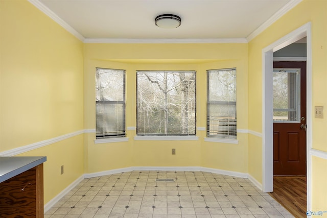 spare room featuring ornamental molding