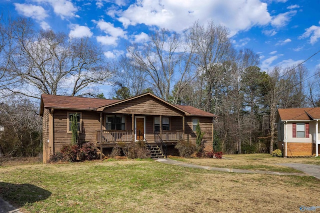 view of front of home with covered porch and a front yard