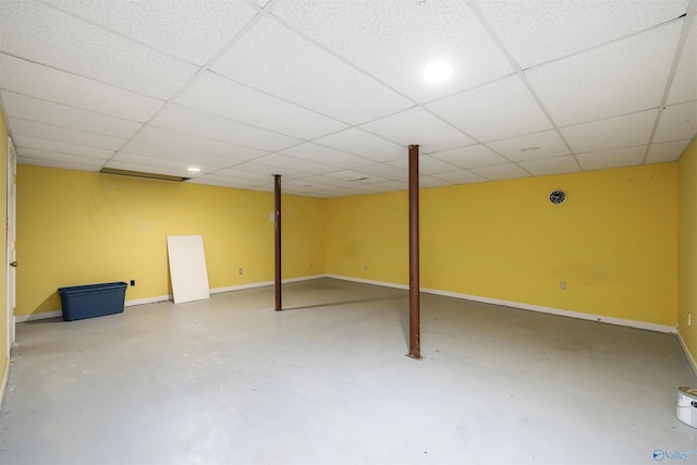 basement with a paneled ceiling