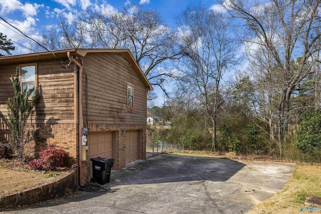 view of property exterior with a garage