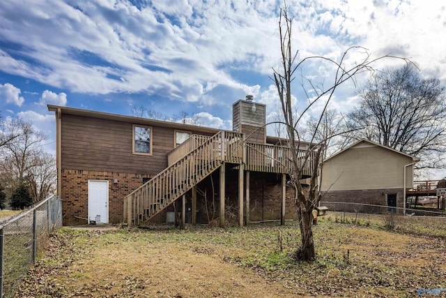 back of property with a wooden deck