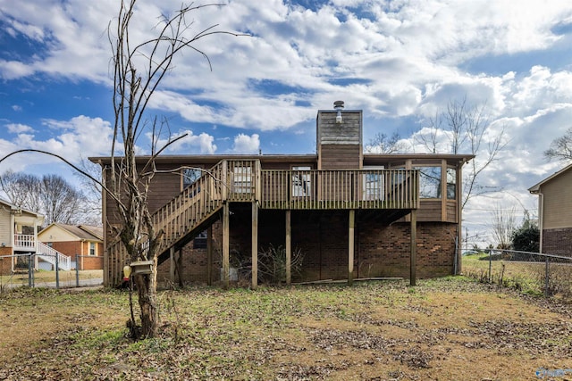 back of house featuring a deck