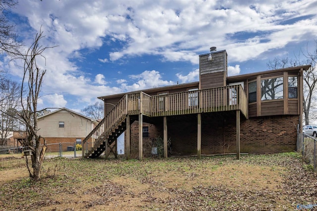 back of house featuring a wooden deck