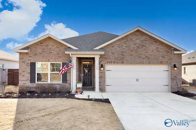 ranch-style house featuring a garage, concrete driveway, brick siding, and fence