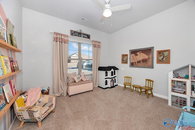 living area featuring a ceiling fan, carpet, visible vents, and baseboards