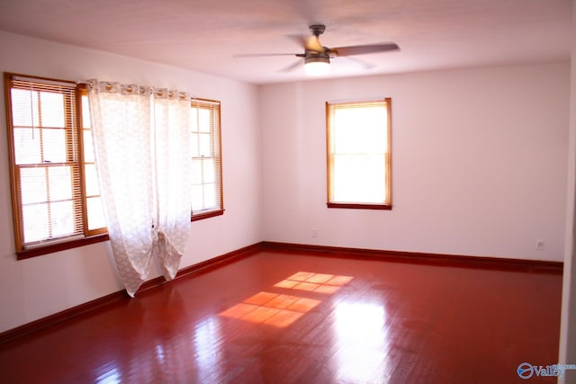 spare room featuring ceiling fan and hardwood / wood-style flooring