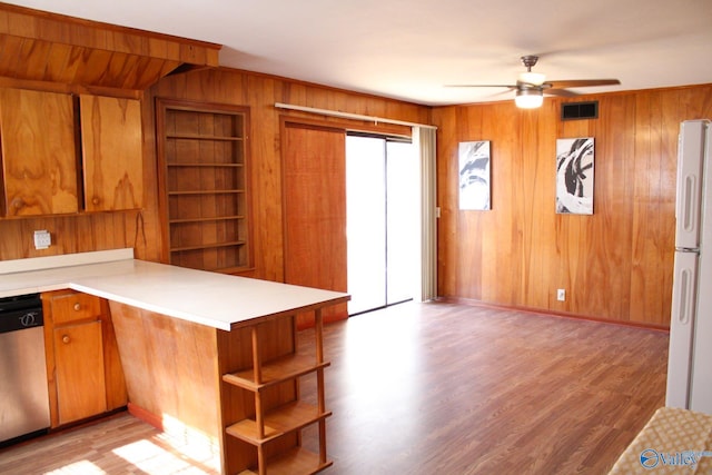 kitchen with ceiling fan, stainless steel dishwasher, kitchen peninsula, white fridge, and light hardwood / wood-style floors