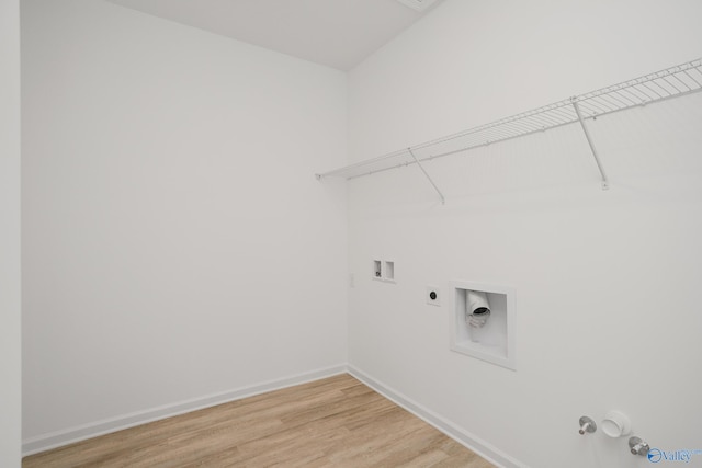 laundry room featuring hookup for a washing machine, gas dryer hookup, hardwood / wood-style flooring, and hookup for an electric dryer