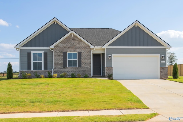 craftsman-style house featuring a garage and a front yard