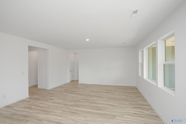 unfurnished room with light hardwood / wood-style flooring