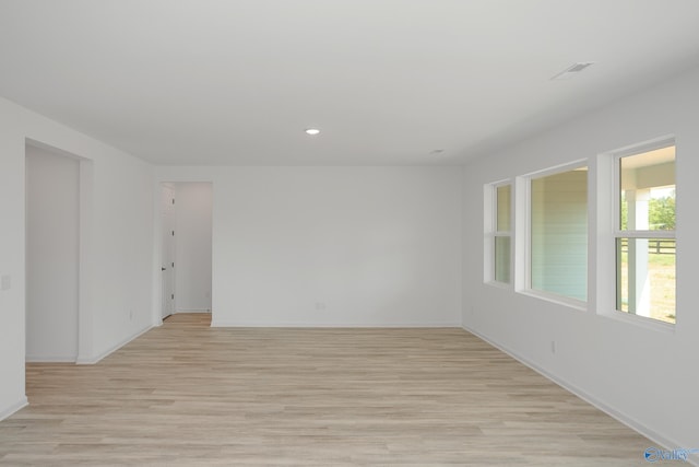 spare room with light hardwood / wood-style floors