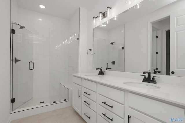 bathroom with vanity, tile patterned floors, and walk in shower