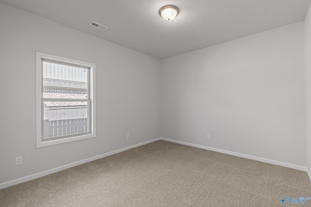 unfurnished room featuring carpet