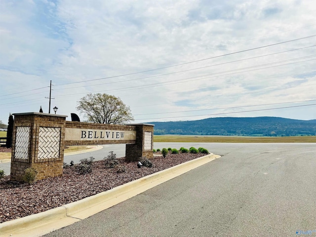 community sign featuring a mountain view