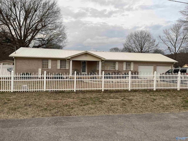 single story home with a garage