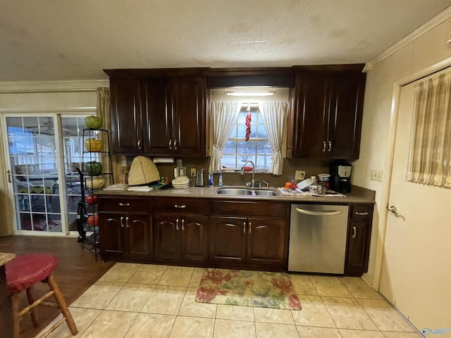 kitchen featuring dark brown cabinetry, sink, a textured ceiling, stainless steel dishwasher, and ornamental molding