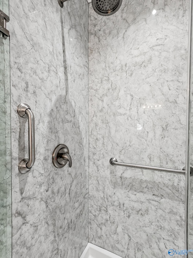 bathroom with a tile shower