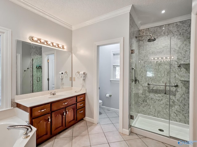 full bathroom with vanity, separate shower and tub, toilet, and a textured ceiling