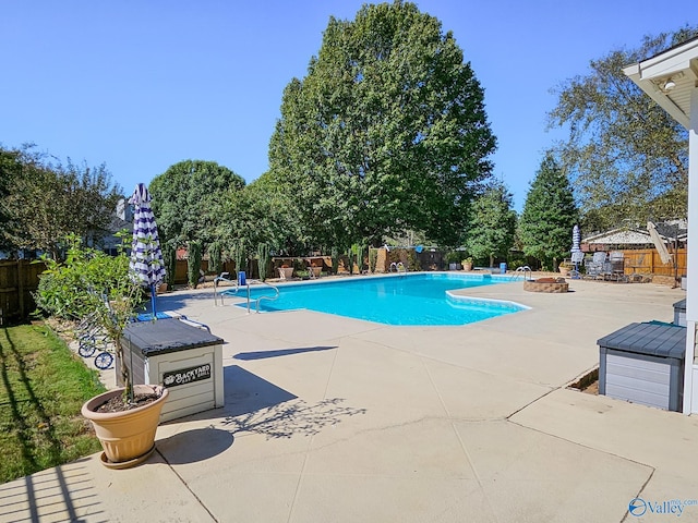 view of swimming pool featuring a patio area