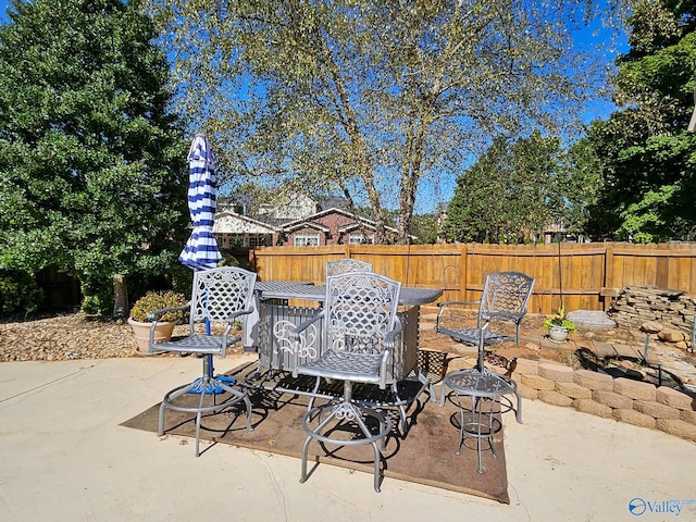 view of patio / terrace with an outdoor fire pit