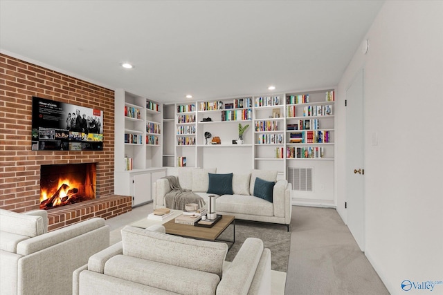 living room featuring a brick fireplace and light colored carpet