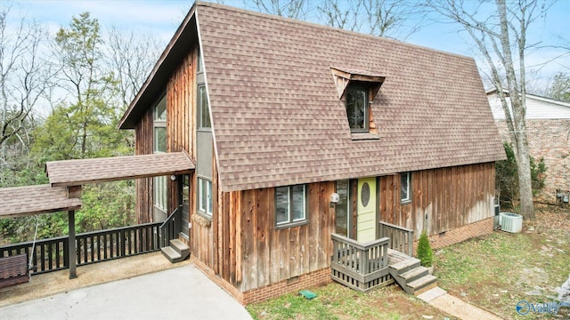 view of front of home with central air condition unit